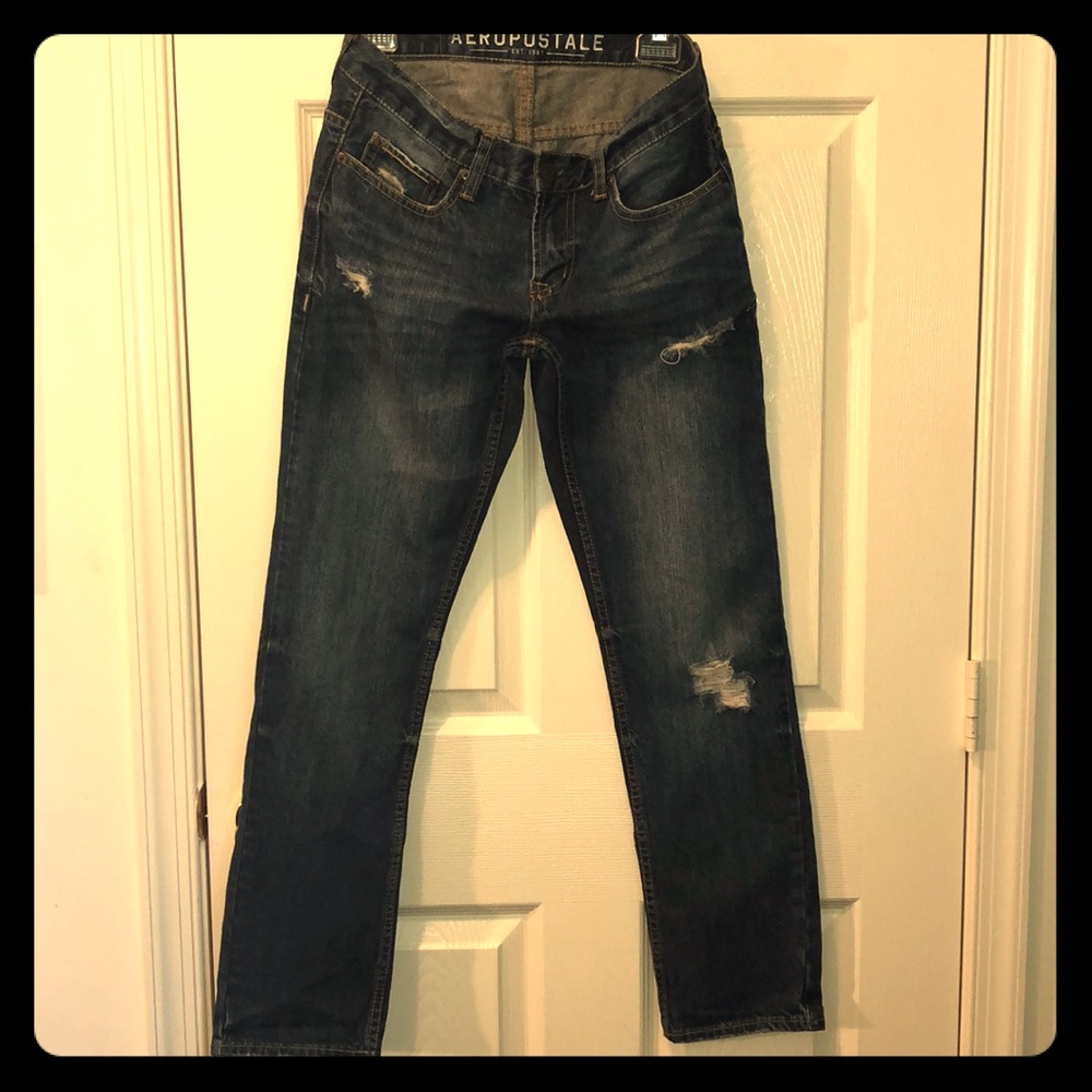 Distressed denim jeans